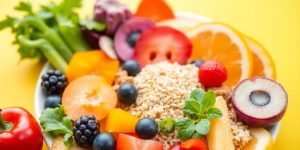 Colorful plate of fresh fruits and vegetables.